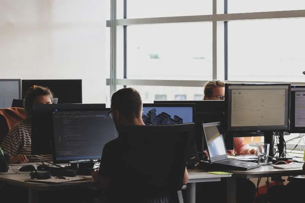 People sitting at computers in an office