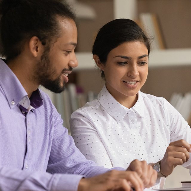 A woman sharing her work with a colleague