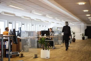 Office space with several people working