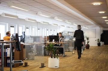 Office space with several people working