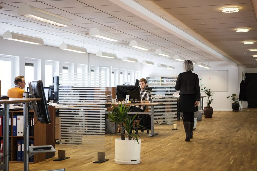 Office space with several people working