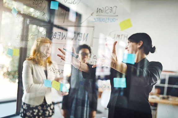 Three woman discussing ideas in an office