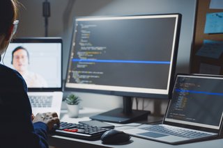 Over the shoulder view of someone using a computer