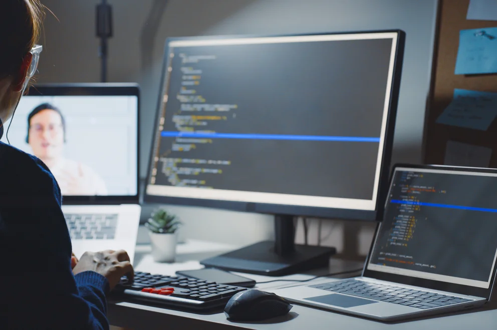 Over the shoulder view of someone using a computer