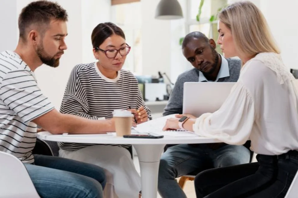 A group of colleagues working on a project