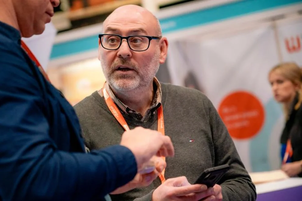 A colleague talking to a customer