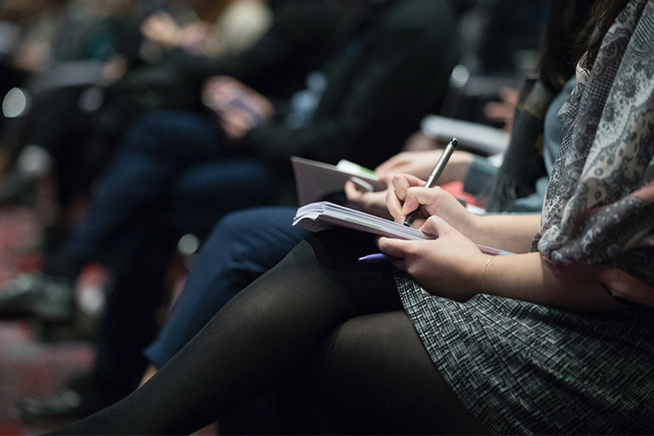 Woman taking notes in a notepad