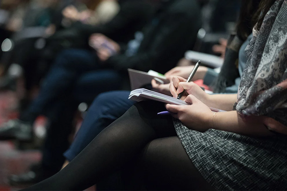 Woman taking notes in a notepad