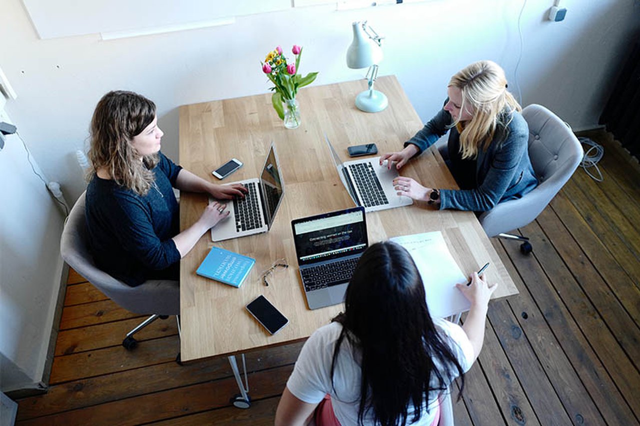 Three woman working in an office