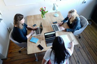 Three woman working in an office