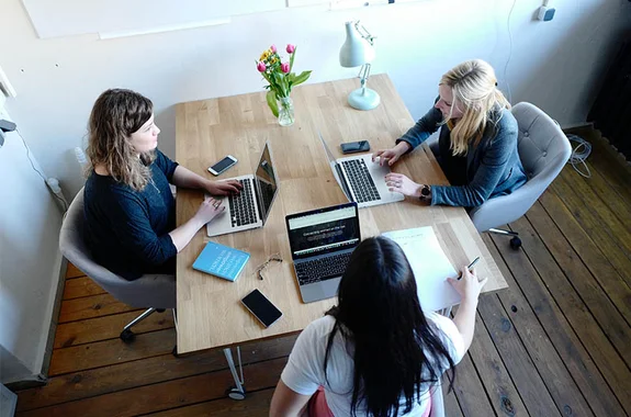 Three woman working in an office