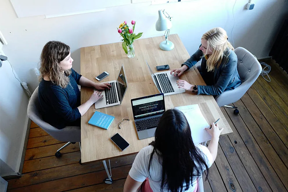 Three woman working in an office