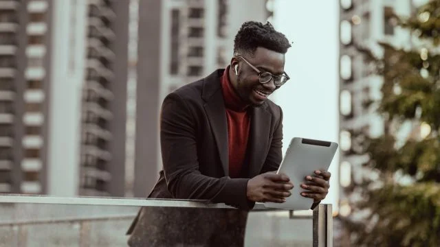A man looking at a notepad