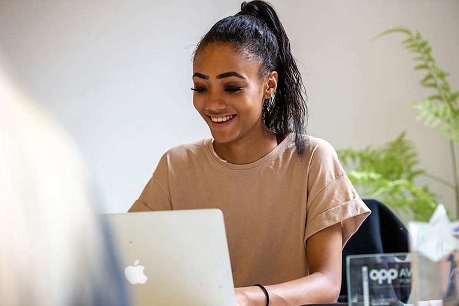 Lady studying on a laptop outside