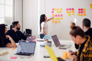 A HR manager leading a strategy meeting