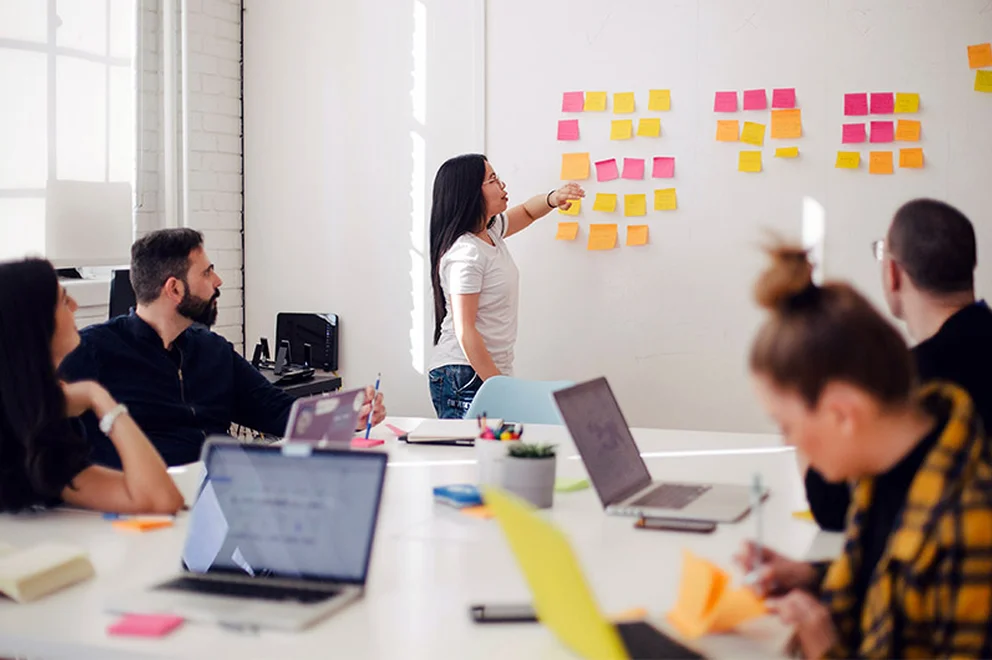 A HR manager leading a strategy meeting