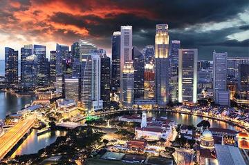 An image of the Singapore skyline and harbour at sunset.