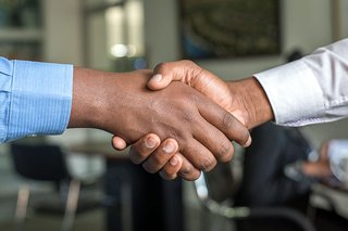 Two people shaking hands