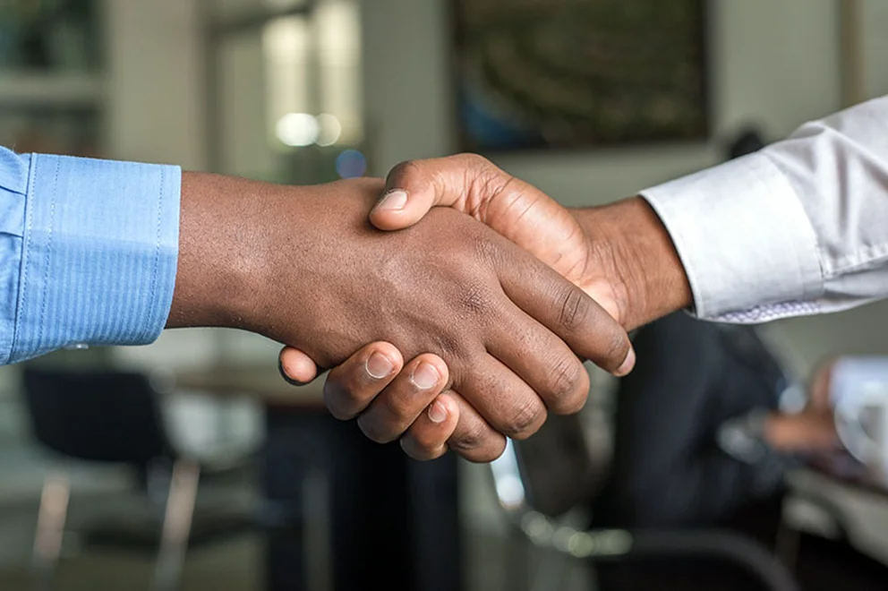 Two people shaking hands
