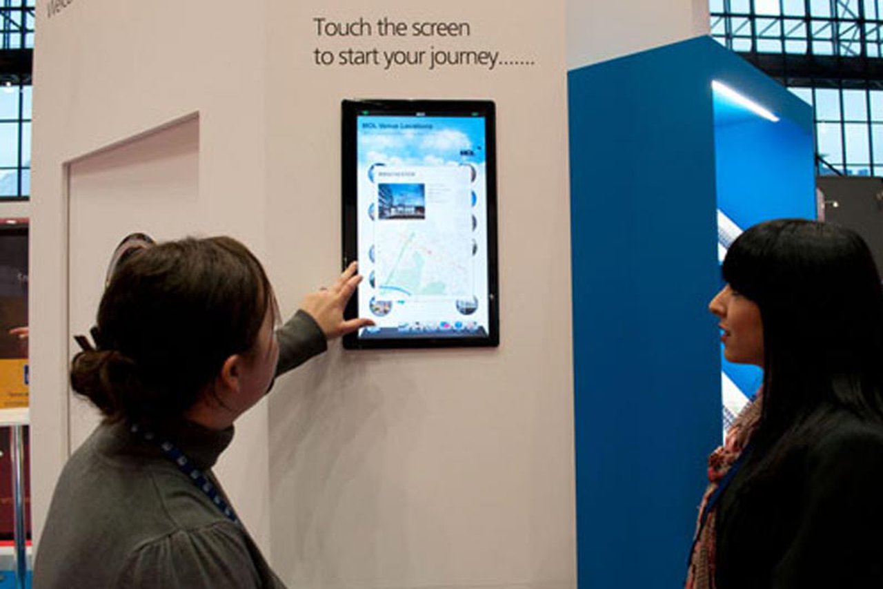 MOL colleagues looking at a tablet at the CIPD annual conference stand