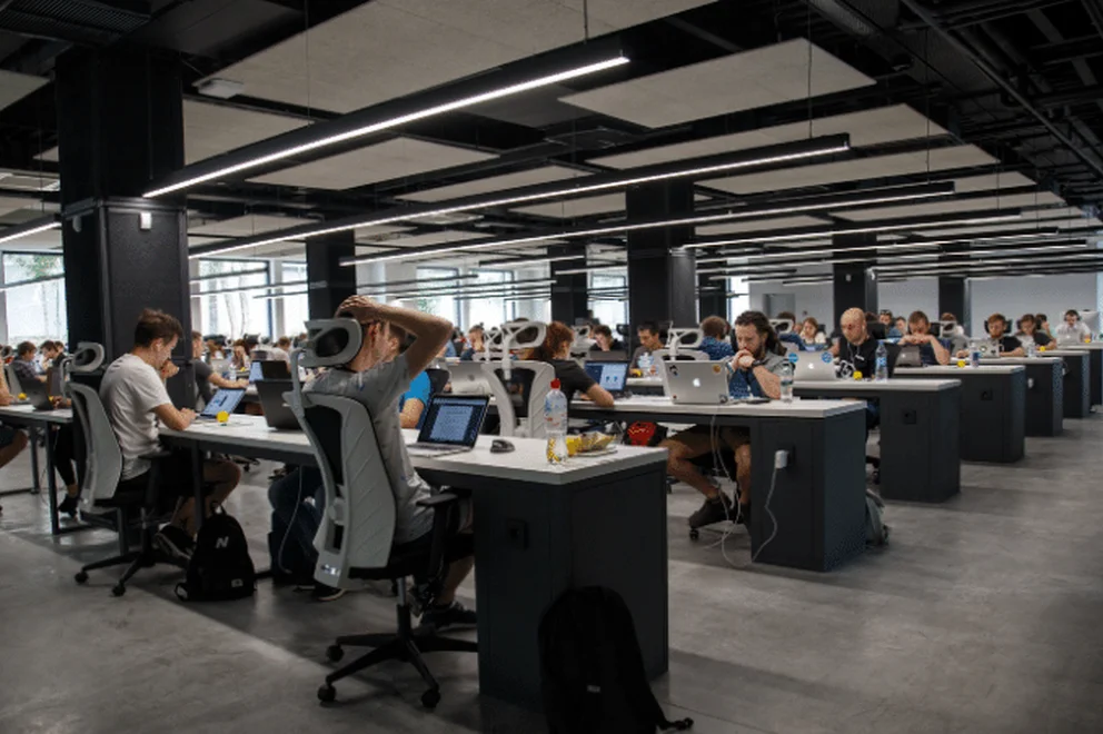 Office space with several people working at desks