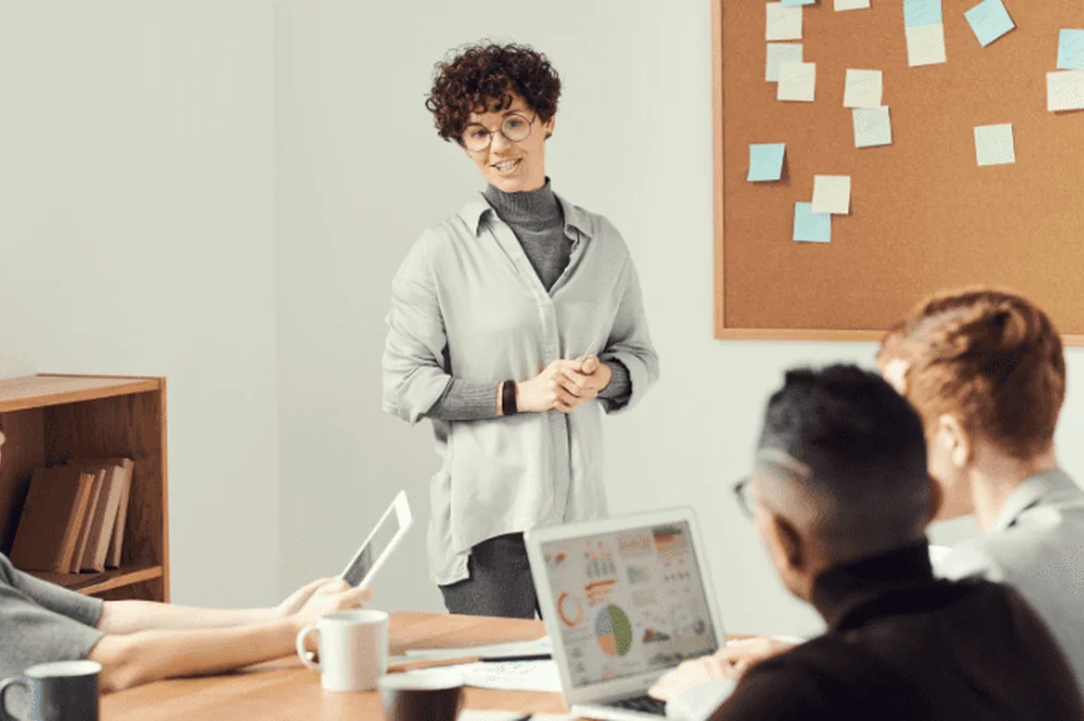 A woman presenting some information to her team