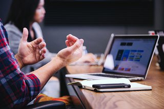 Colleagues at work around a table