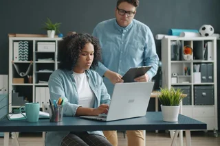 A tutor helping a student with work