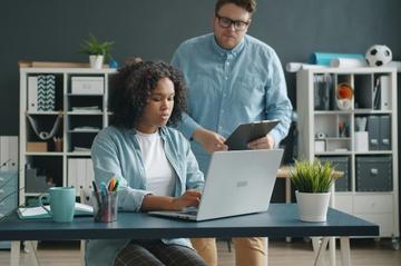 A tutor helping a student with work