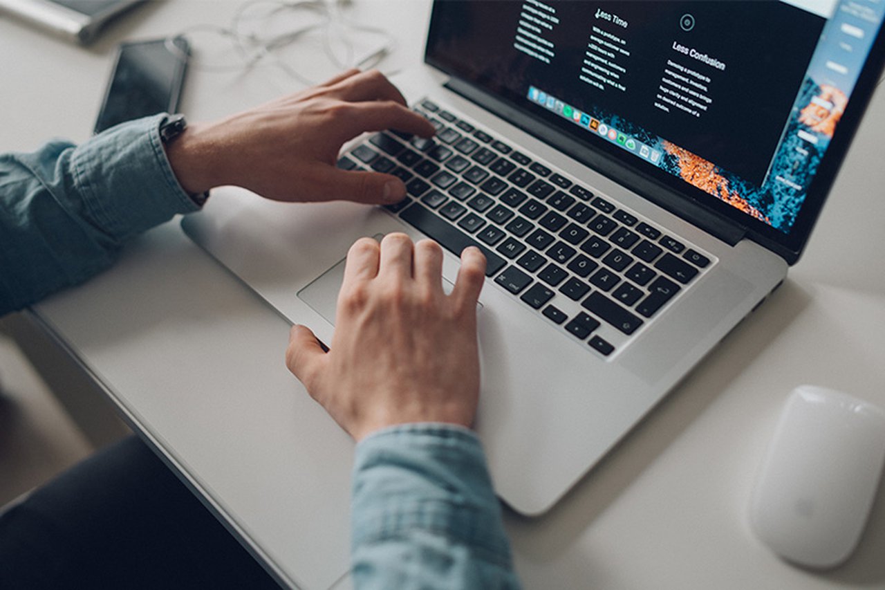 Hands on a laptop.