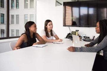 Three women in an office.
