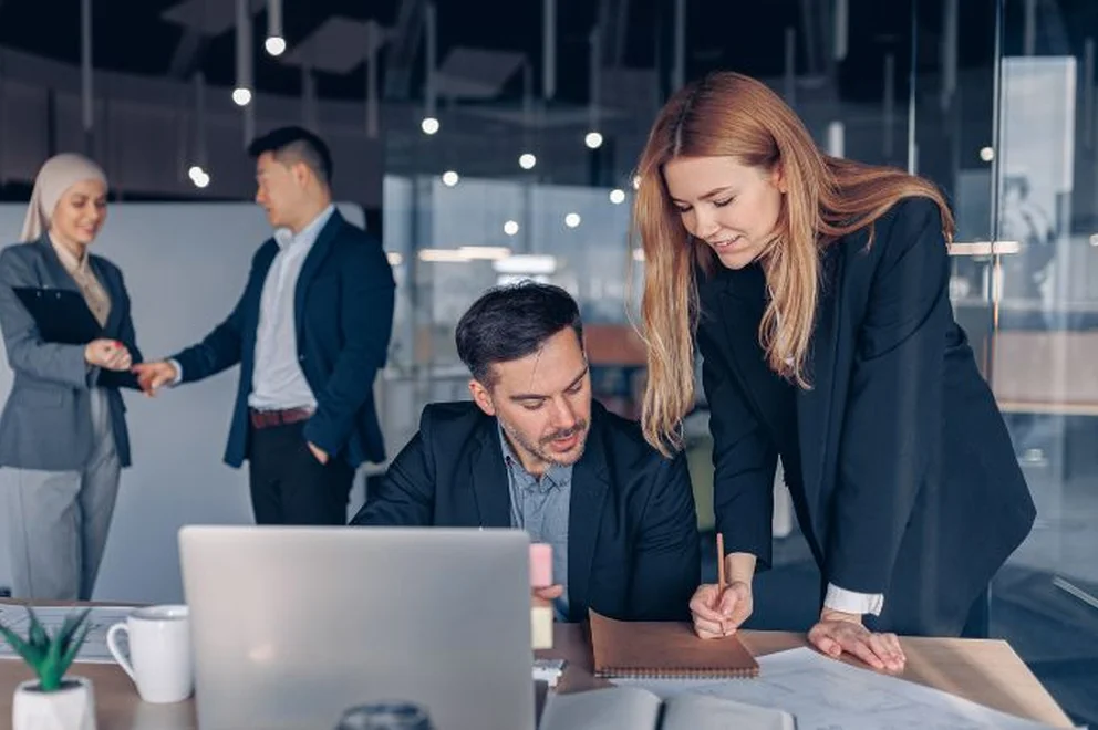 Two Colleagues looking at a piece of work