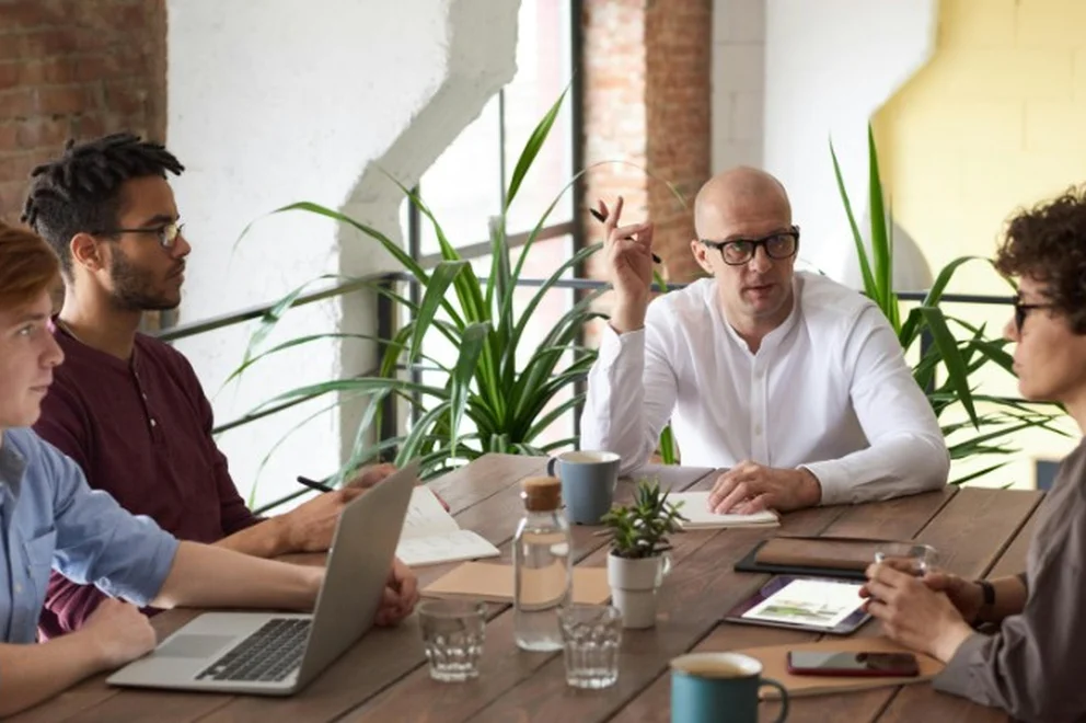 A group of colleagues having a meeting together