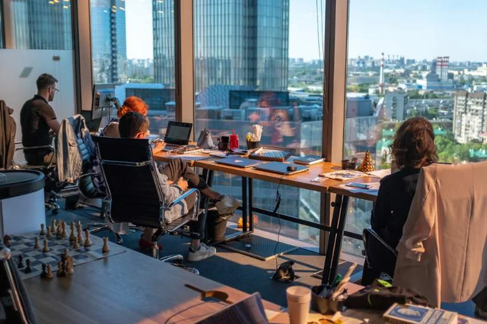 Three people working in the office