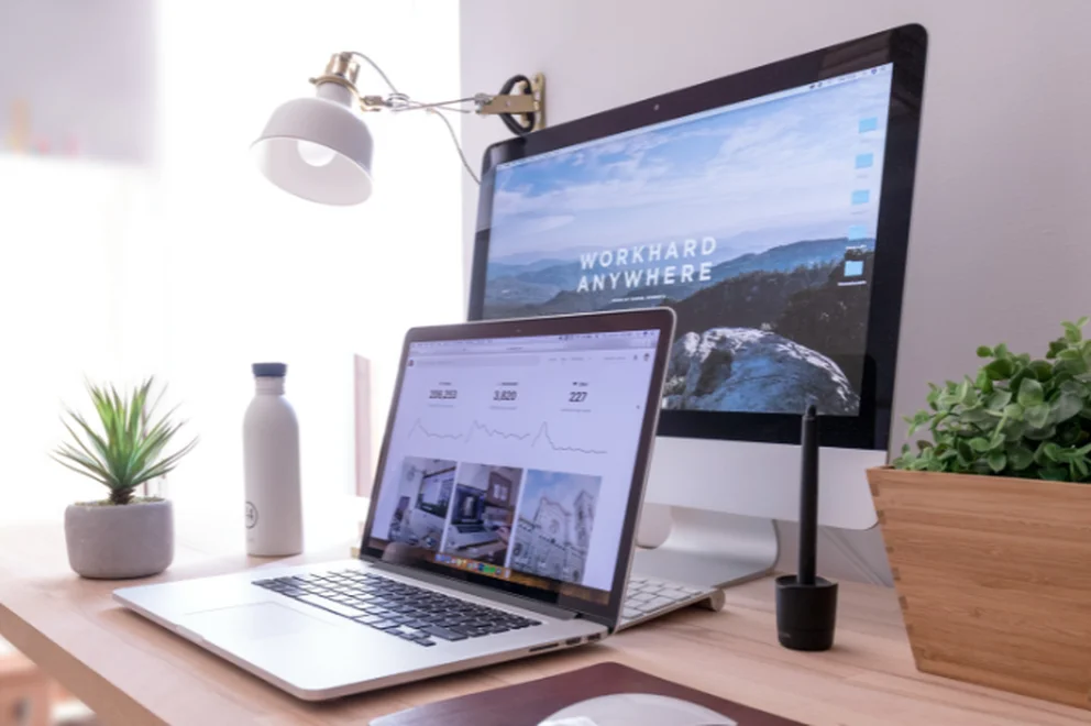 A laptop and a desktop screen